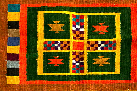A Jamkhana dhurrie with traditional dice design